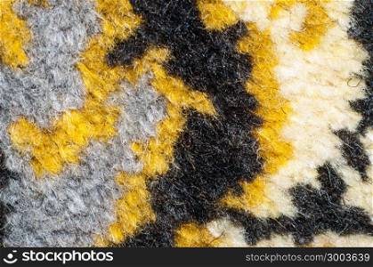 Fragment of the pattern of the carpet is made of natural wool