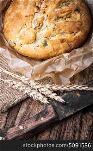 Fragrant baked bread. Fragrant homemade baked bread in a rural style. Bread with herbs