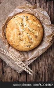 Fragrant baked bread. Fragrant homemade baked bread in a rural style. Bread with herbs