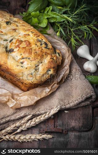 Fragrant baked bread. Fragrant homemade baked bread in rustic style. Bread with herbs