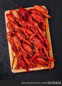 Fragrant boiled crayfish on a wooden board
