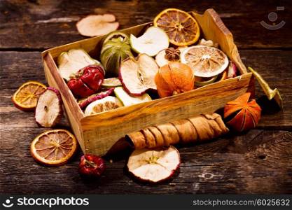 Fragrant decoration of dried fruits on a wooden table