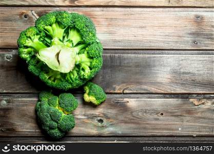 Fragrant fresh broccoli. On a wooden background.. Fragrant fresh broccoli.