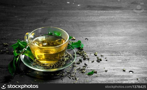 fragrant green tea with leaves. On the black chalkboard. fragrant green tea with leaves.