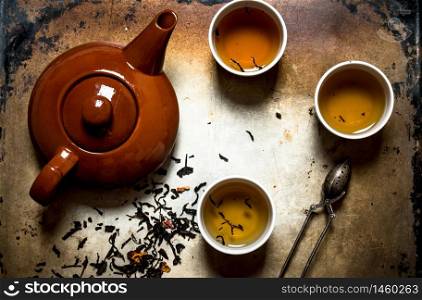 Fragrant herbal tea on an old rustic table.. Fragrant herbal tea