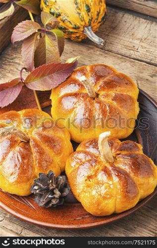 Fragrant homemade buns made from pumpkin dough.. Homemade pumpkin buns.
