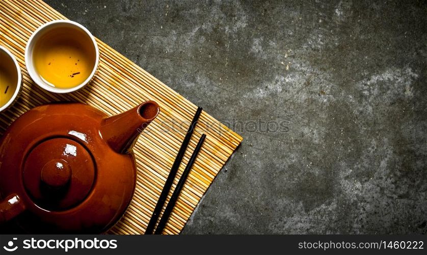 Fragrant Japanese tea . On the stone table.. Fragrant Japanese tea