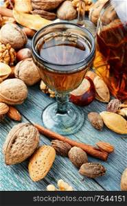 Fragrant nutty liquor tincture.Walnut liquor, sweet table alcoholic drink. Autumn nutty liquor