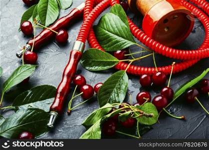 Fragrant smoking hookah with cherry tobacco. Oriental tobacco hookah.. Turkish shisha with cherry.