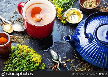 Fragrant useful herbal tea with hypericum.Herbal medicine.Tea with herbs.. Herbal tea with hypericum