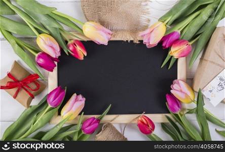 frame chalkboard decorated by tulips gift boxes