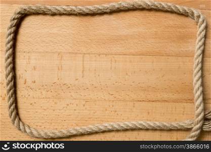 Frame for text or for photo from marine rope on wooden boards
