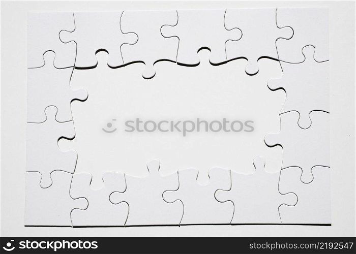 frame made from white puzzle piece white background
