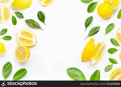 Frame made of fresh lemon with green leaves on white background.