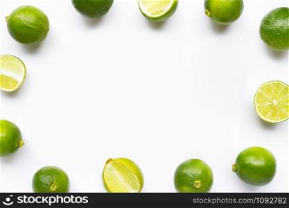 Frame made of limes isolated on white background. Copy space