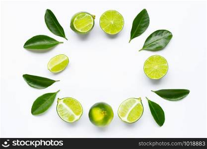 Frame made of Limes with leaves isolated on white background.