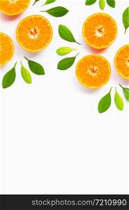 Frame made of Orange with green leaves isolated on white background. Copy space