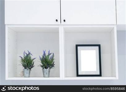 Frame mock up in modern home on white shelf. Frame mock up in modern home