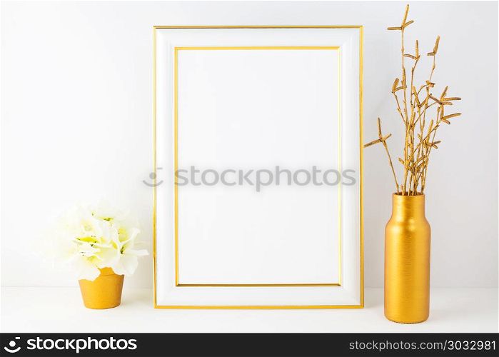Frame mockup with ivory hydrangea in the golden flower pot. Poster white frame mockup. Empty white frame mockup for presentation artwork.. Frame mockup with ivory hydrangea in the golden flower pot