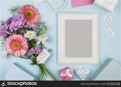 frame near fresh flowers with title tag decorations