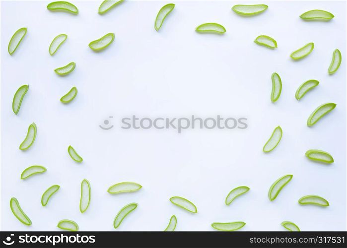 Frame of Aloe vera slices isolated on white background.