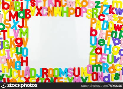 Frame of Colorful alphabet magnets on a whiteboard