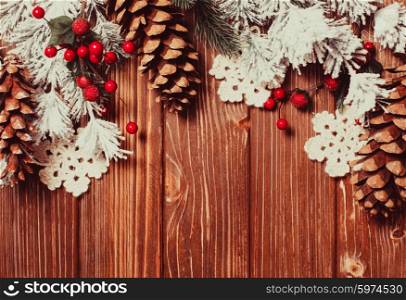 Frame of gingerbreads and winter decor on a wooden background.. The Christmas backgrounds