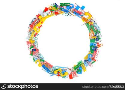 Frame of stationery isolated on a white background. A set of clips and pins.