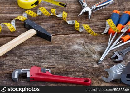 frame of tools kit on wooden background