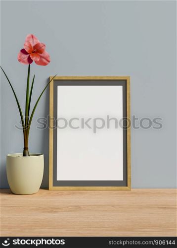 Frame on table with flower.