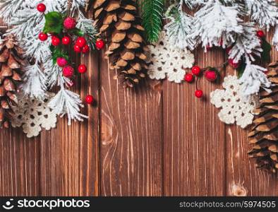 Frame winter decor on a wooden background.. Christmas backgrounds
