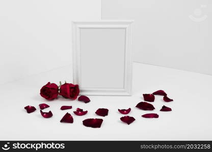 frame with red roses white table