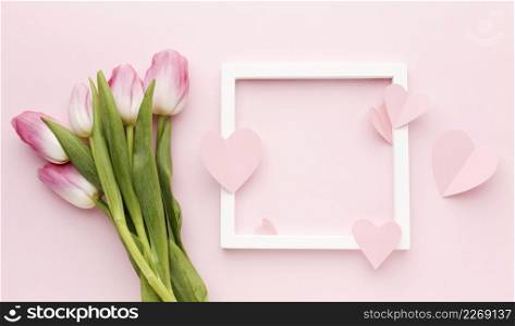 frame with tulips bouquet beside