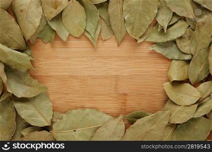 Framed dry bay leaf on a wooden board
