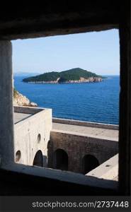 Framed view on Lukrum island on the Adriatic Sea from Fort Lovrijenac in Dubrovnik, Croatia