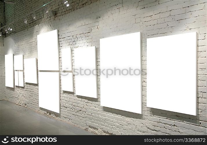 Frames on a brick wall