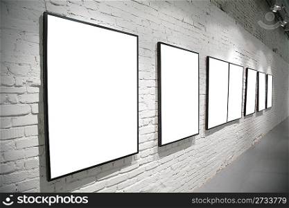frames on brick white wall