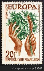 FRANCE - CIRCA 1957: a stamp printed in the France shows Hands with Symbols of Agriculture and Industry, United Europe for Peace and Prosperity, circa 1957