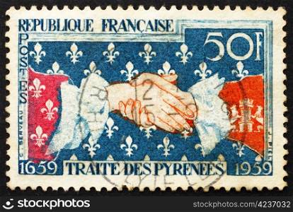 FRANCE - CIRCA 1959: a stamp printed in the France shows French-Spanish Handshake, 300th Anniversary of the Signing of the Treaty of the Pyrenees, circa 1959