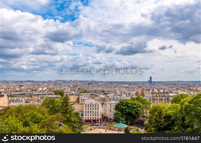 France. Paris. Summer day. Panoramic view of the roofs. The clouds are running fast. The Eiffel Tower is not visible. Panoramic View of Paris and Clouds