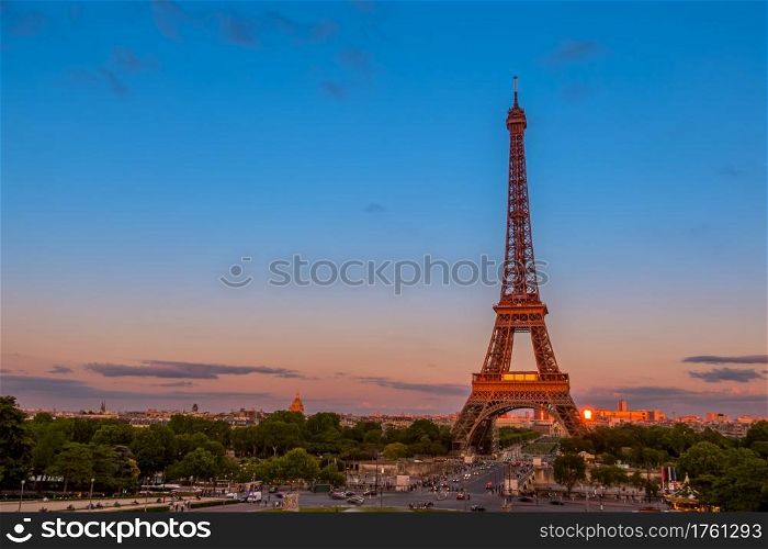France, Paris. Summer twilight. Traffic near the Eiffel Tower. Summer Twilight and Traffic near the Eiffel Tower