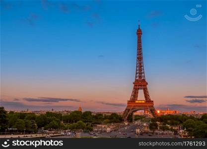 France, Paris. Summer twilight. Traffic near the Eiffel Tower. Summer Twilight and Traffic near the Eiffel Tower