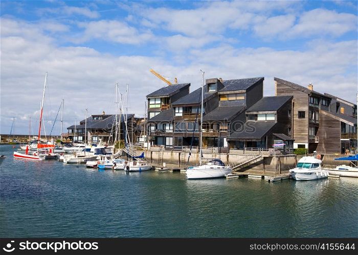 France, resort city Dovill. Boats in a bay before houses