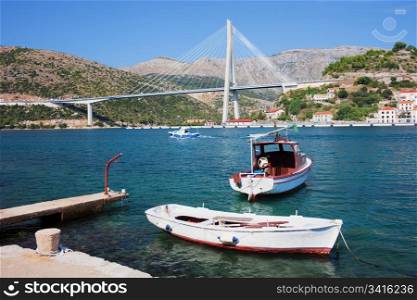 Franjo Tudjman Bridge at the entrance to Dubrovnik from western side in tranquil scenery of the Adriatic Sea coastline in Croatia, Dalmatia County