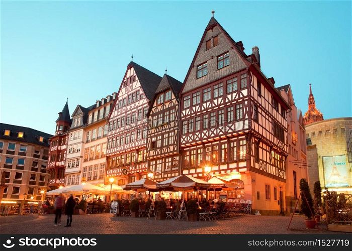 Frankfurt am Main, Hesse, Germany - Night life at restaurants and Souvenir Shops at Romerberg square, the old town center and the Romer building.