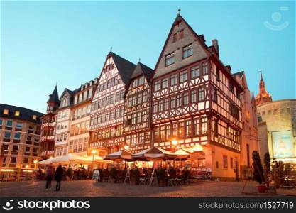 Frankfurt am Main, Hesse, Germany - Night life at restaurants and Souvenir Shops at Romerberg square, the old town center and the Romer building.