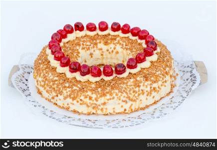 Frankfurt crown cake with cherries on white background. Frankfurt crown cake with cherries on white background.