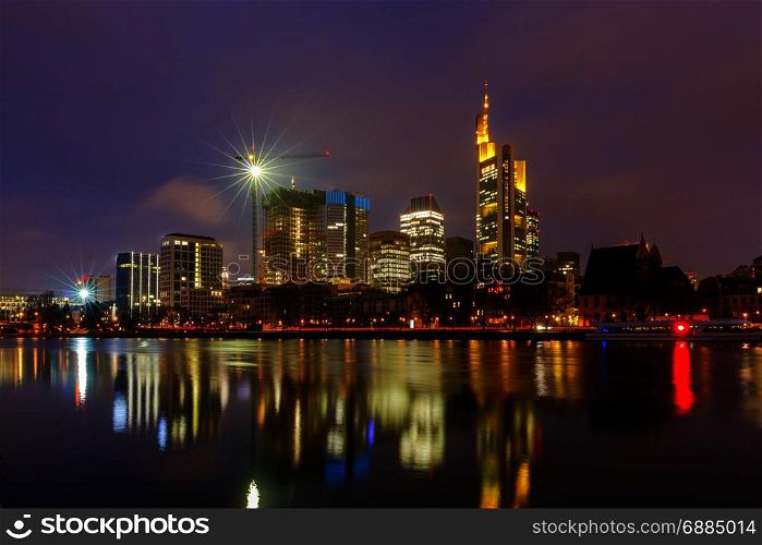 Frankfurt. Skyscrapers of the city&rsquo;s business center.. Picturesque views of the city&rsquo;s waterfront and skyscrapers at night in Frankfurt. Germany.
