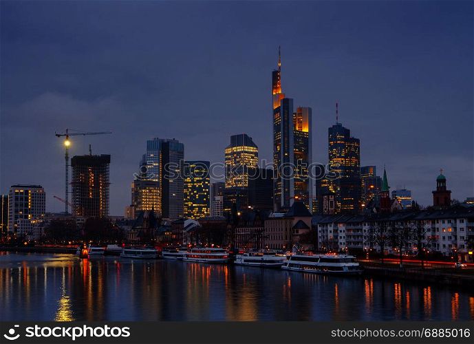 Frankfurt. Skyscrapers of the city&rsquo;s business center.. Picturesque views of the city&rsquo;s waterfront and skyscrapers at night in Frankfurt. Germany.