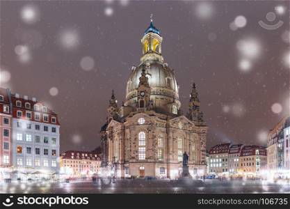 Frauenkirche at night in Dresden, Germany. Lutheran church of Our Lady aka Frauenkirche with market place at snowy christmas night in Dresden, Saxony, Germany